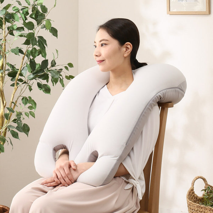 Pillow that wraps around the upper body